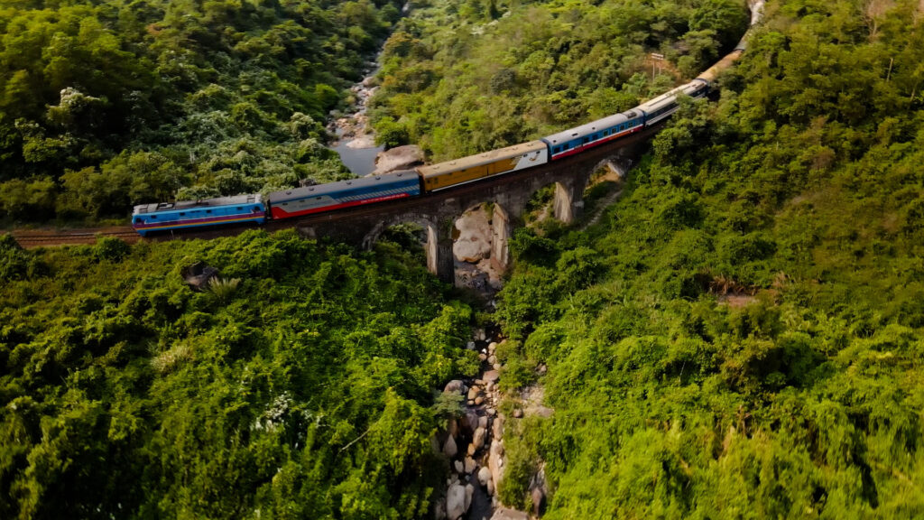 Train crossing the Don Ca arch bridge on Hai Van Pass