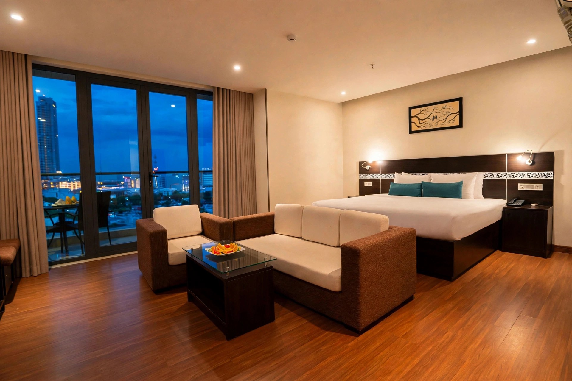 Suite living area with balcony at Sea Garden Hotel Da Nang